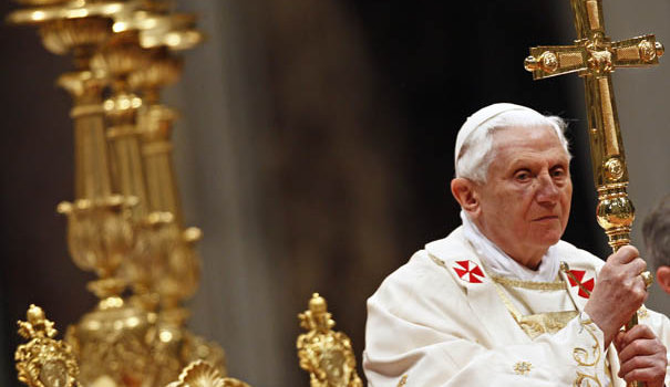 Pope Benedict XVI holds the cross as he leads the Easter vigil mass in Saint Peter's Basilica at the Vatican